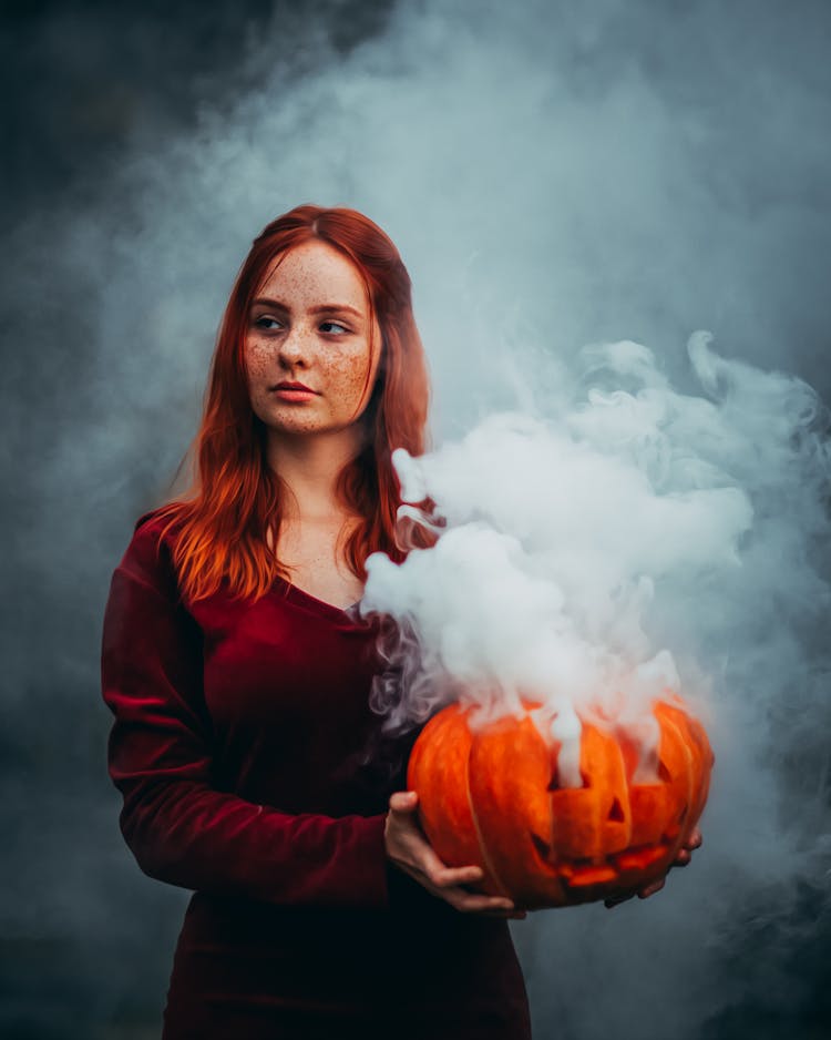 Woman With Pumpkin In Smoke