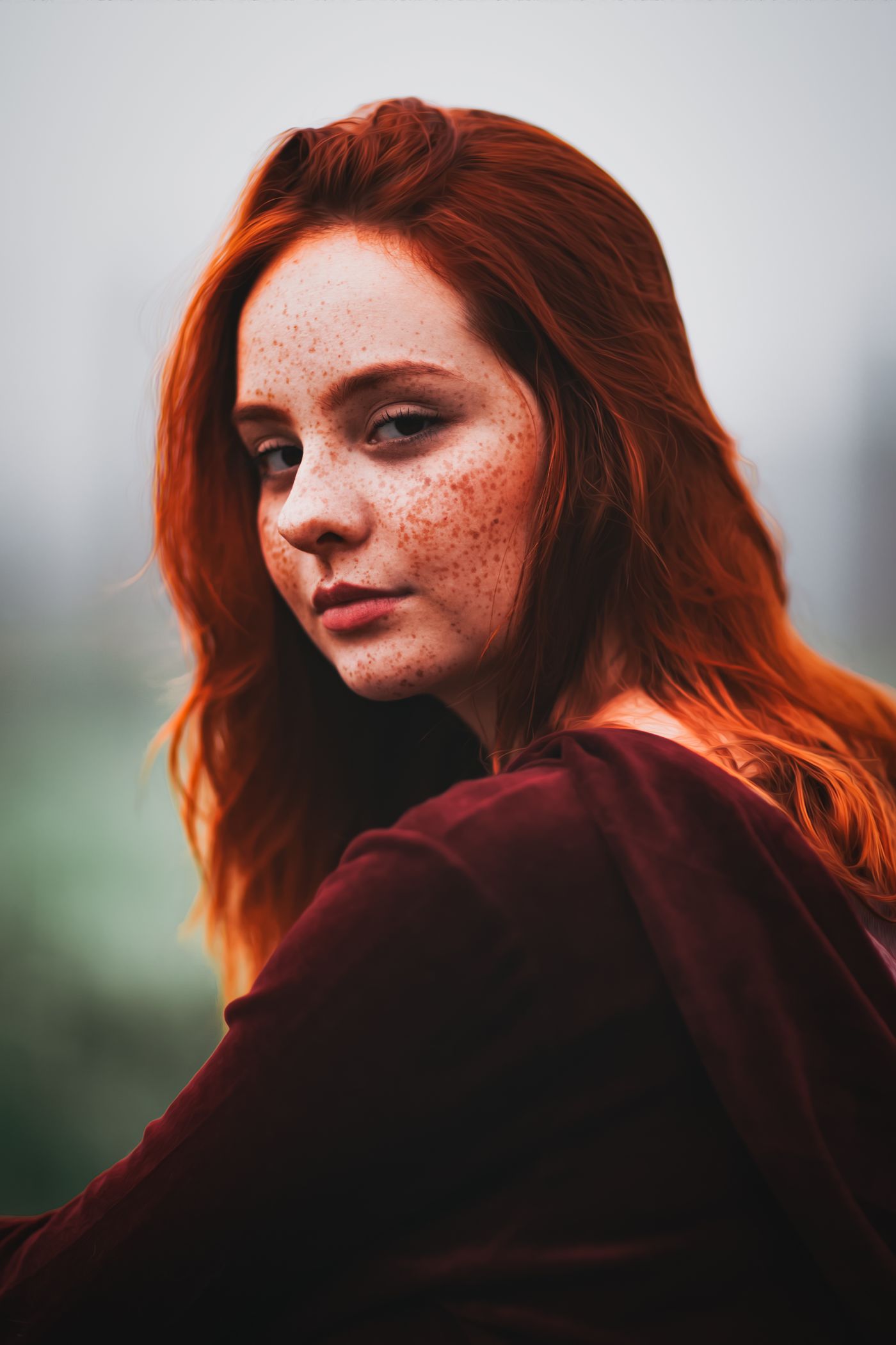 Editorial portrait with freckles in warm light