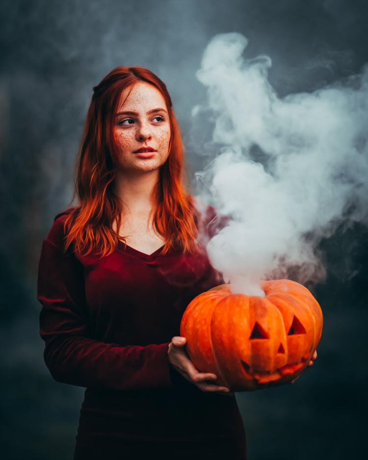 Woman With Pumpkin In Smoke