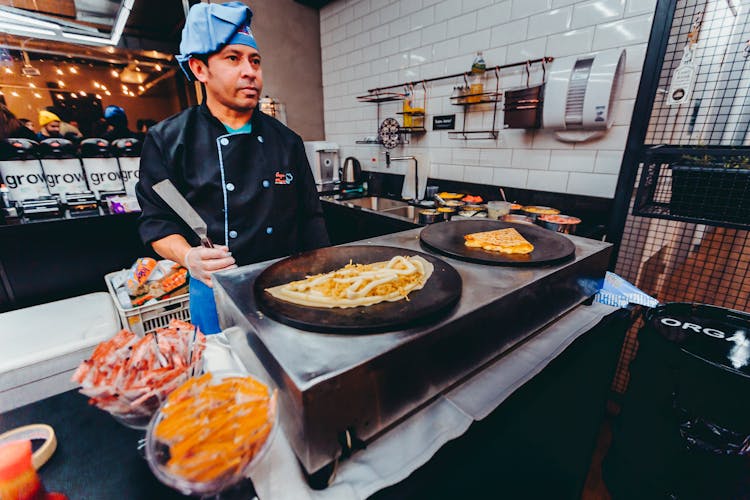 A Man Working In A Kitchen