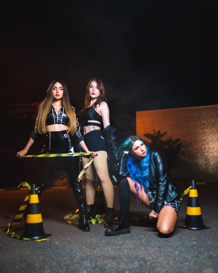 Three Girls On A Road At Night 