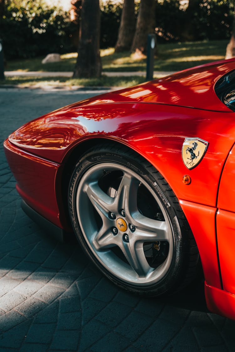 Close-up Of Modern Red Ferrari Car On Street