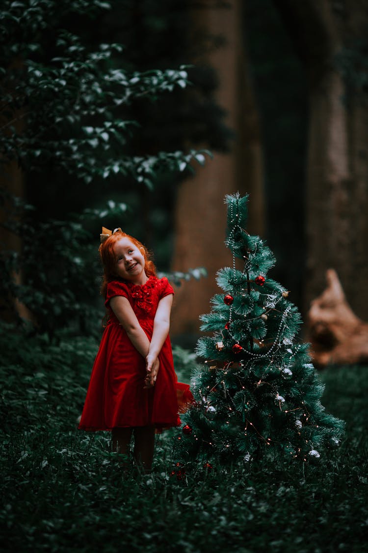 Girl Posing By Christmas Tree