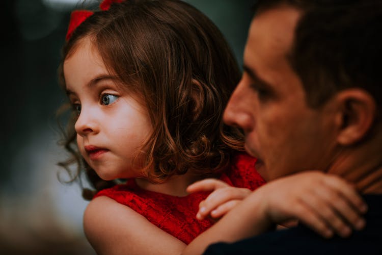 Close Up Photo Of Man Carrying A Girl