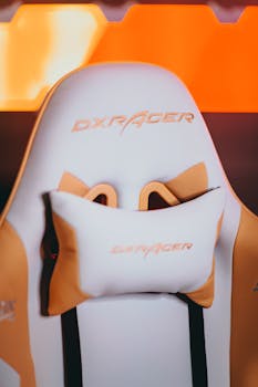 A stylish gaming chair with orange accents for enhanced comfort and support.