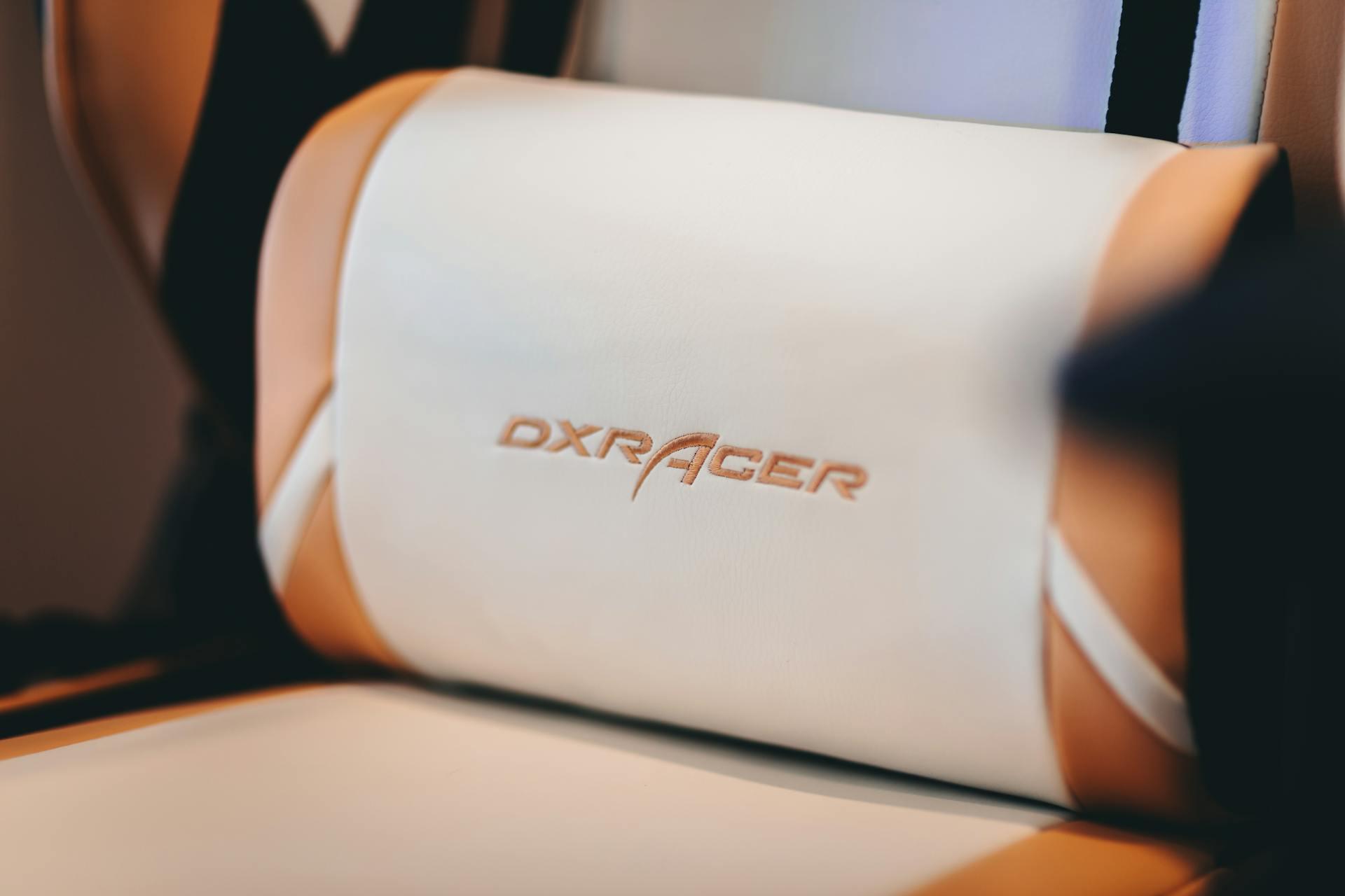 A White and Brown Cushion with Label on a Gaming Chair