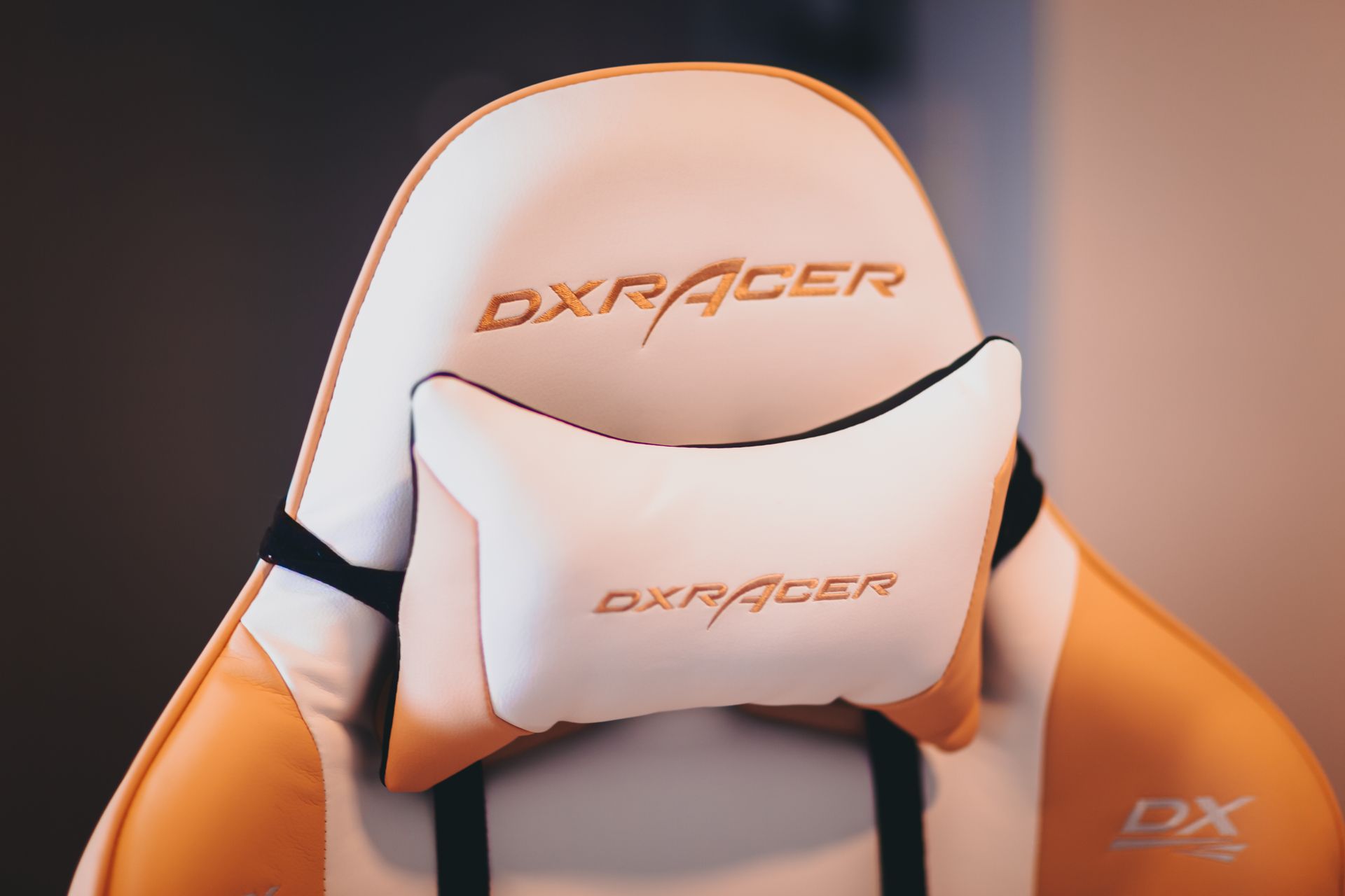 A White and Brown Gaming Chair with Head Cushion