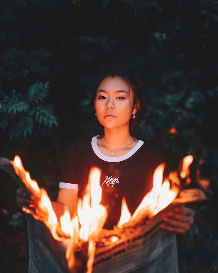 Girl In Forest With Burning Paper