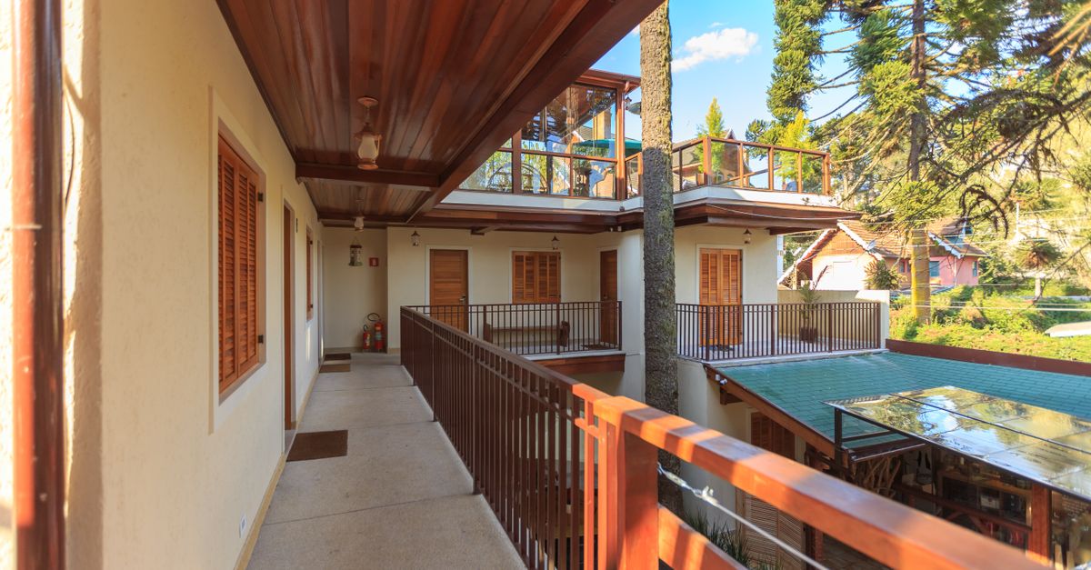 Spacious balcony area in a villa featuring modern architecture and scenic views.