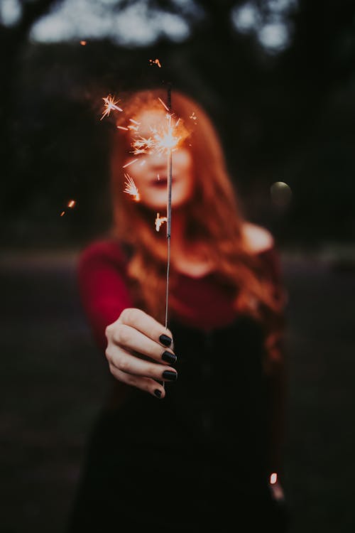 Woman Holding a Sparkler in her Hand