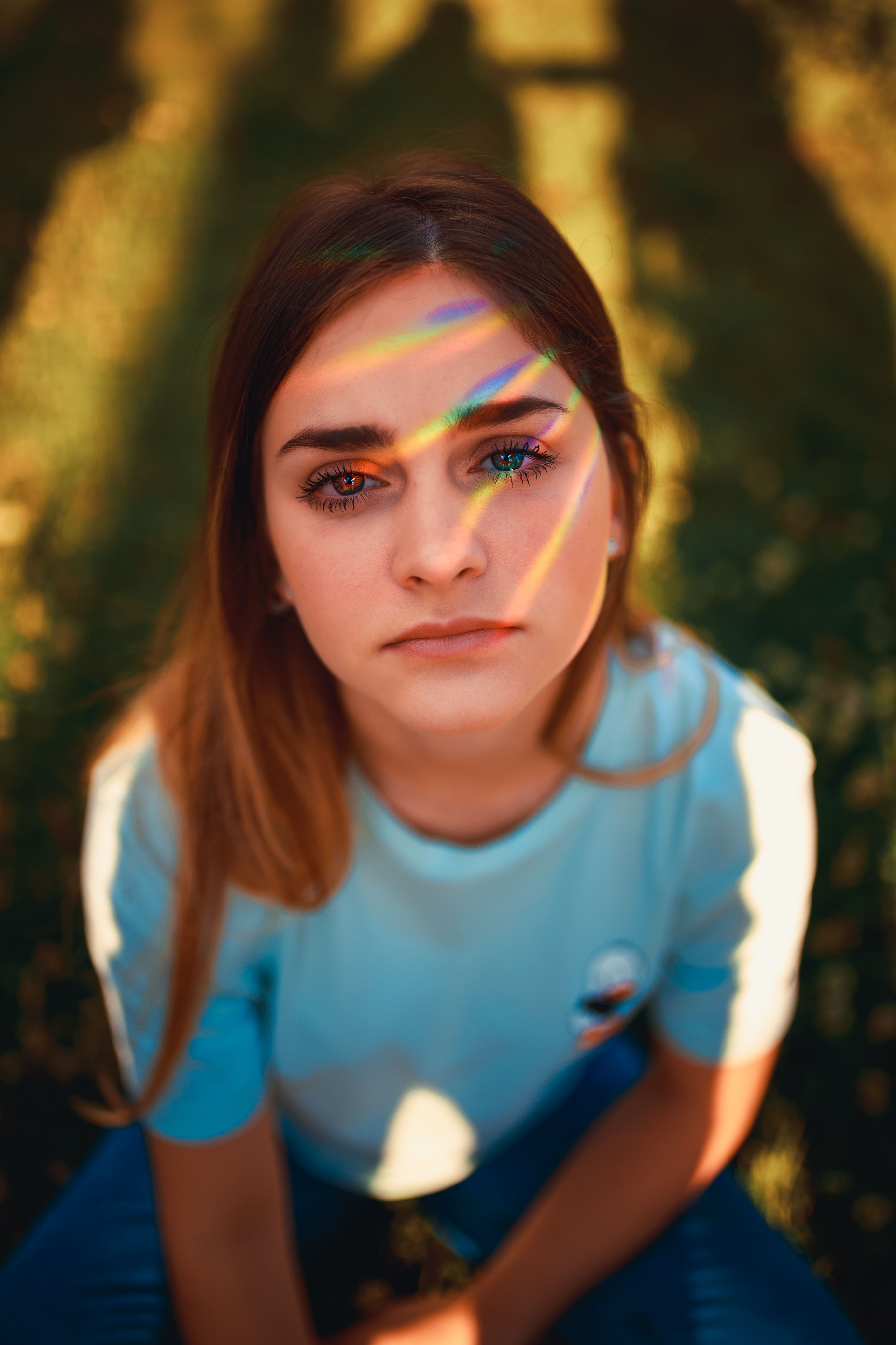 A Woman in Blue Shirt Sitting on a Chair · Free Stock Photo
