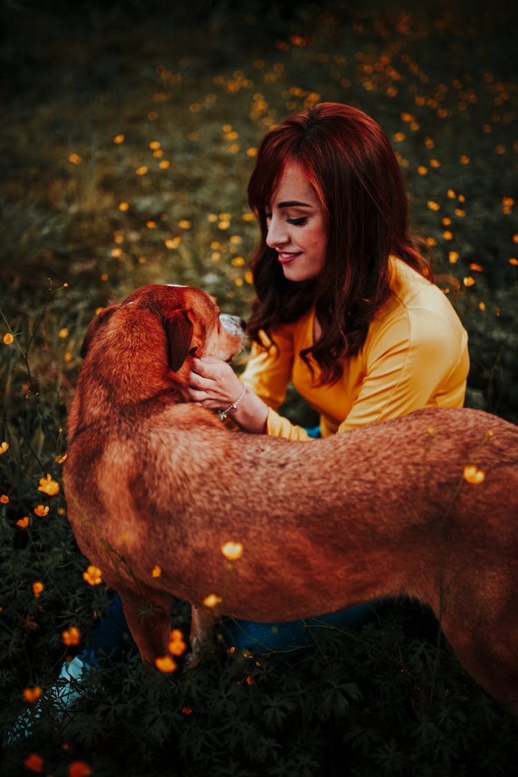 Woman And Dog In Grass