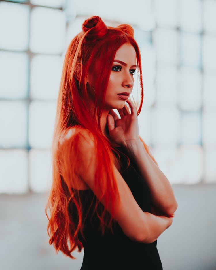 Woman With Long Red Dyed And Stylized Hair