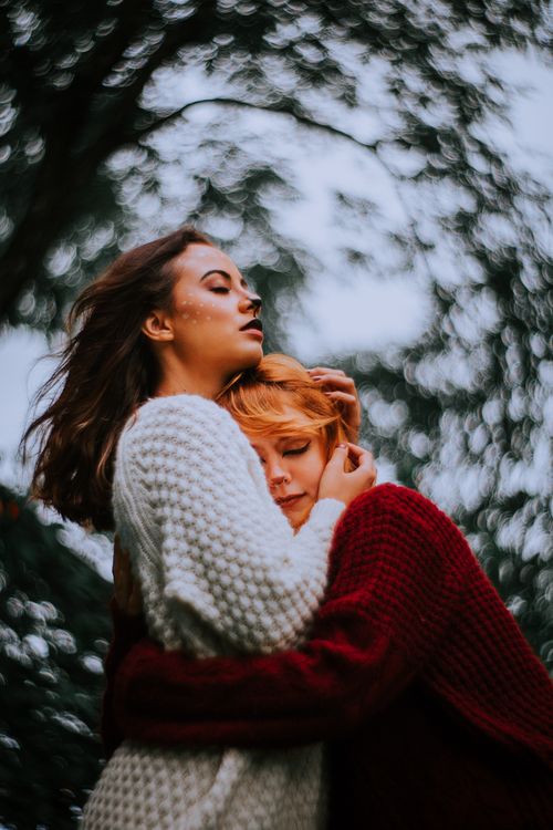 Free Two women embracing outdoors in cozy sweaters, showing deep connection and warmth. Stock Photo