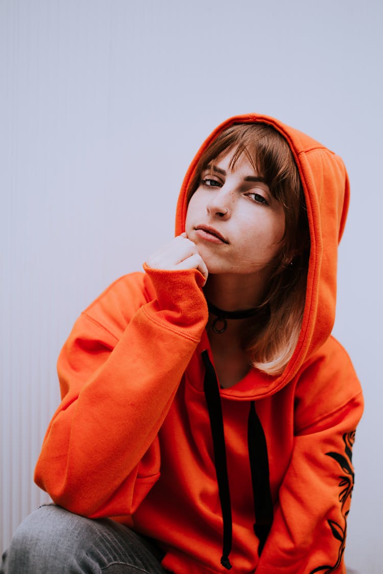 Young Woman In An Orange Hoodie 