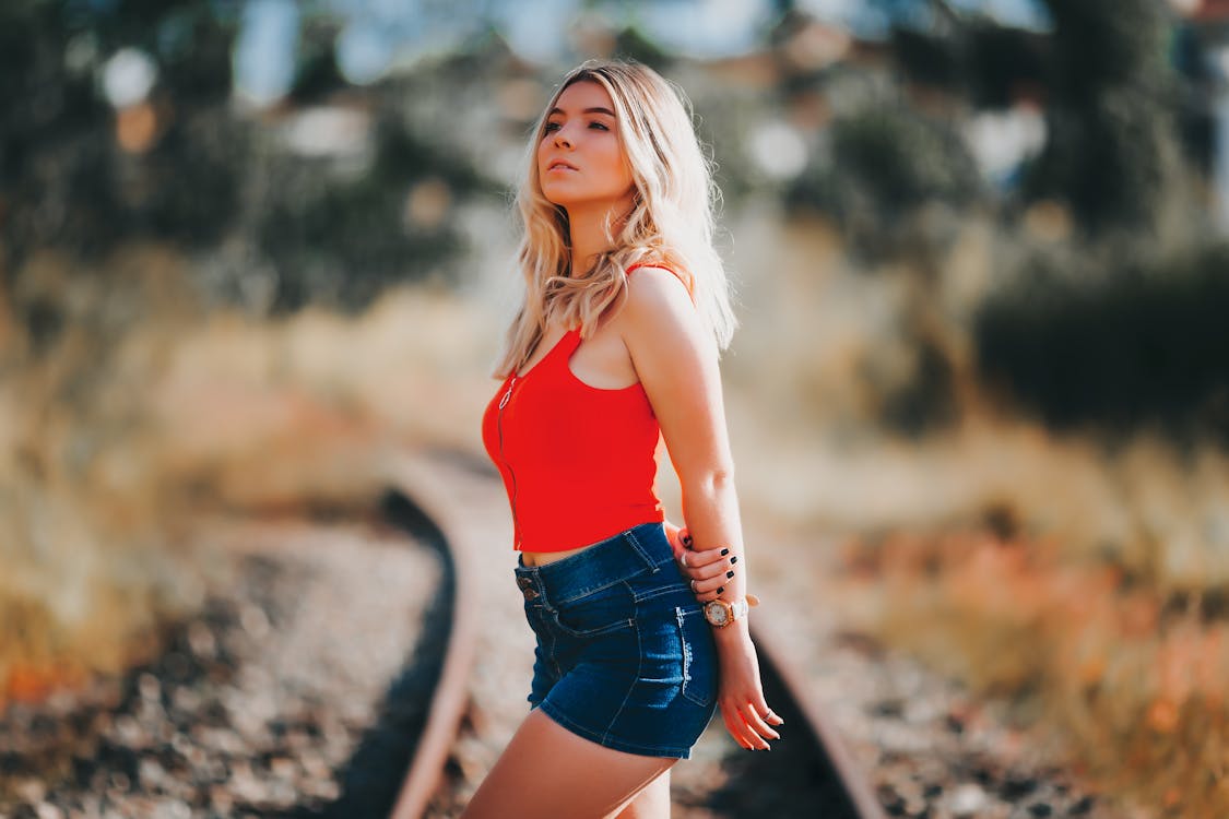 Beautiful Woman Wearing Denim Shorts And Top Outdoors In Desert Location  Stock Photo, Picture and Royalty Free Image. Image 102080154.