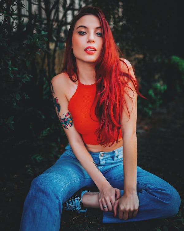 Photo of a Woman with Red Hair Sitting · Free Stock Photo