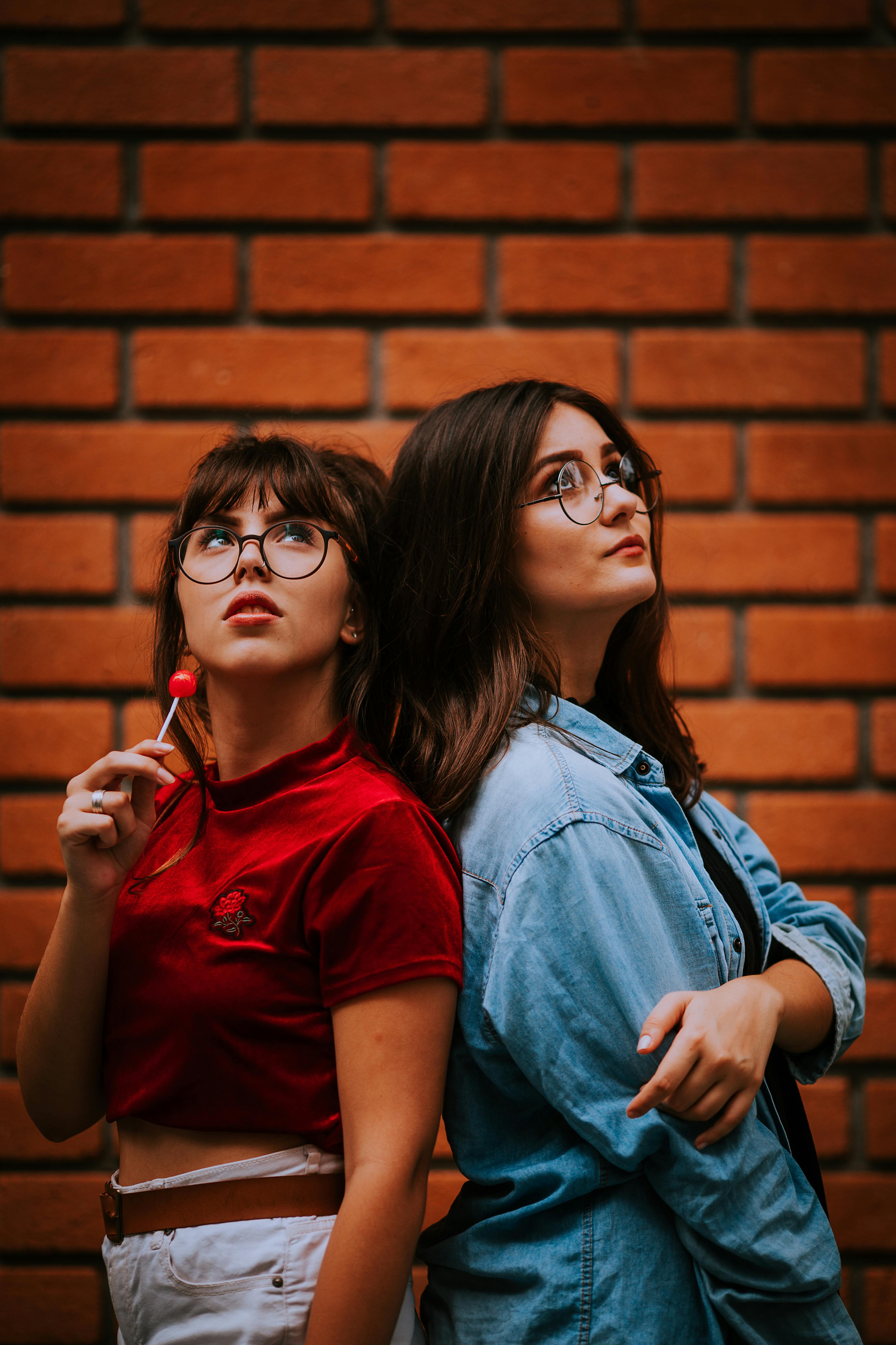 close up shot of two women wearing eyeglasses