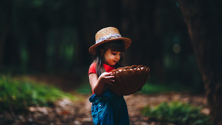 Pretty Girl Carrying A Basket