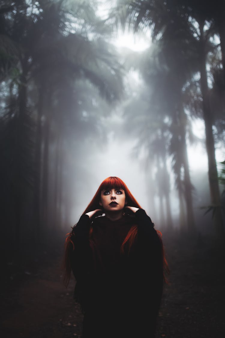 Portrait Of Woman In Forest Under Fog