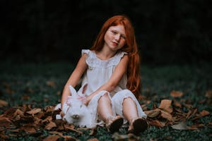 Girl Sitting with Rabbit