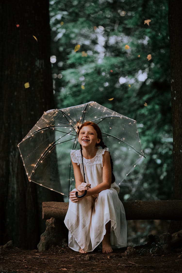 Girl With Transparent Umbrella With Light