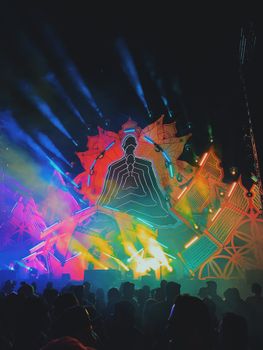 Electrifying night concert with colorful stage lighting at a festival in Itu, Brazil.