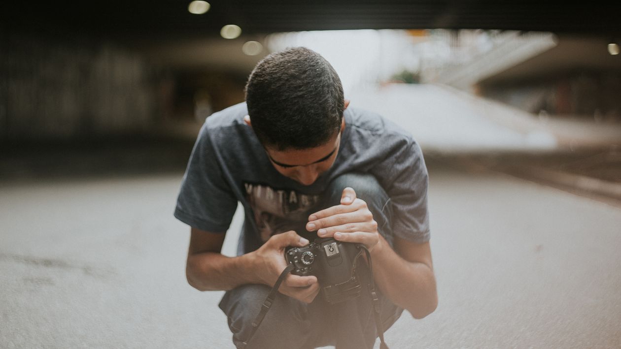 Men Click Camera Focus Man Looking at Camera Screen · Free Stock Photo