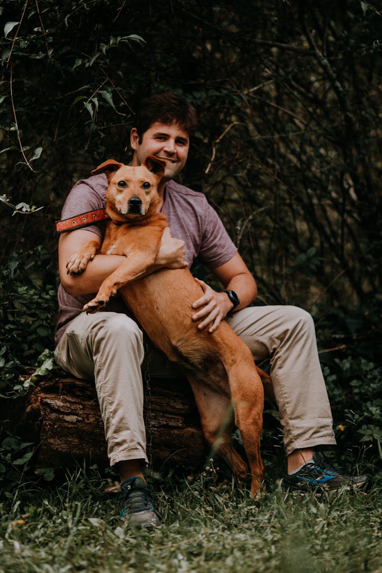 Man Sitting With Dog