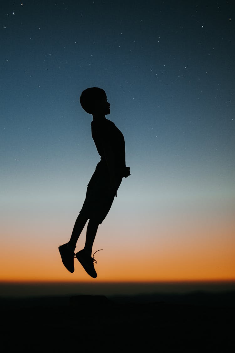 Silhouette Of A Boy Jumping