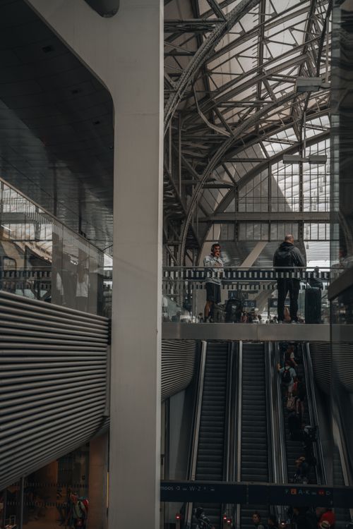 Free A modern subway station showcasing architectural elegance with escalators and people in view. Stock Photo
