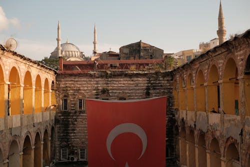 View of a Large Flag of Turkey Hanging on the Facade of the Buyuk Yeni Han, Istanbul, Turkey