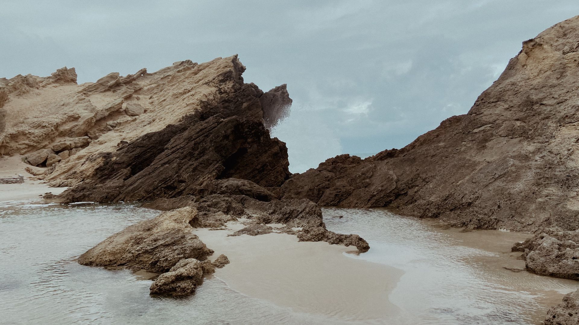 Captivating view of rocky coastline at Kareedouw, South Africa with crashing waves.