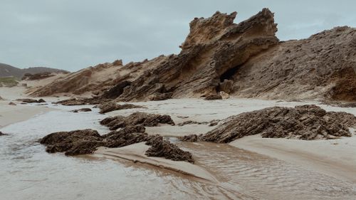 Free Captivating rocky coastline in Kareedouw, South Africa under an overcast sky. Stock Photo