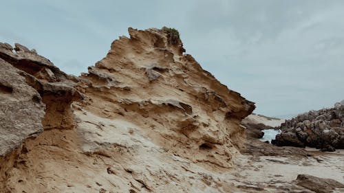 Fotos de stock gratuitas de arena, orilla del mar, piedra