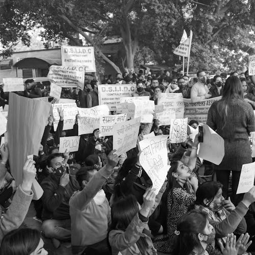 A Grayscale of People Protesting