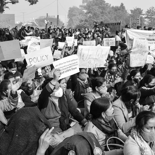 Grayscale Photo of People Protesting