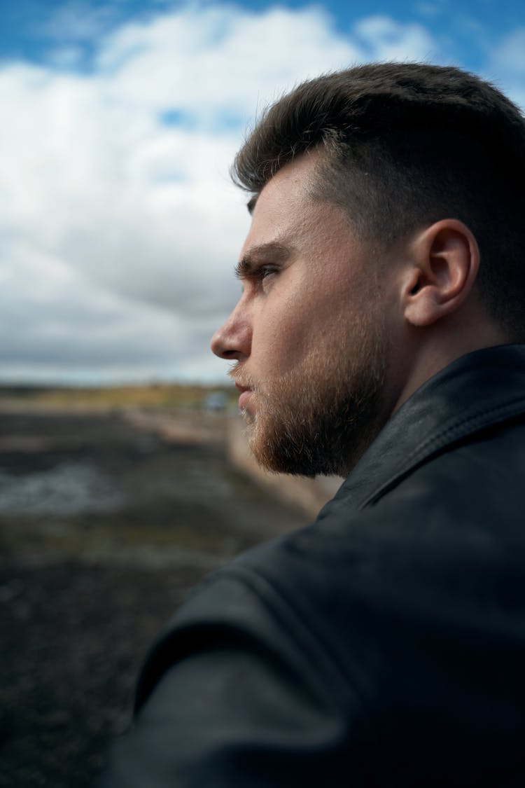 Man In Black Jacket Looking At The Sky