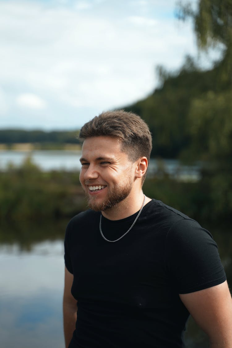 Man In Black Crew Neck T-shirt Smiling