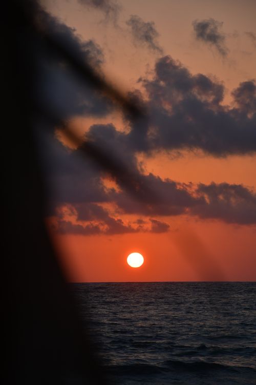 Free Breathtaking view of the sunset over the sea at Phalasarna Beach, Greece. Stock Photo