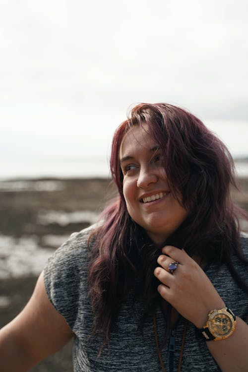 Woman in Gray Vest Smiling