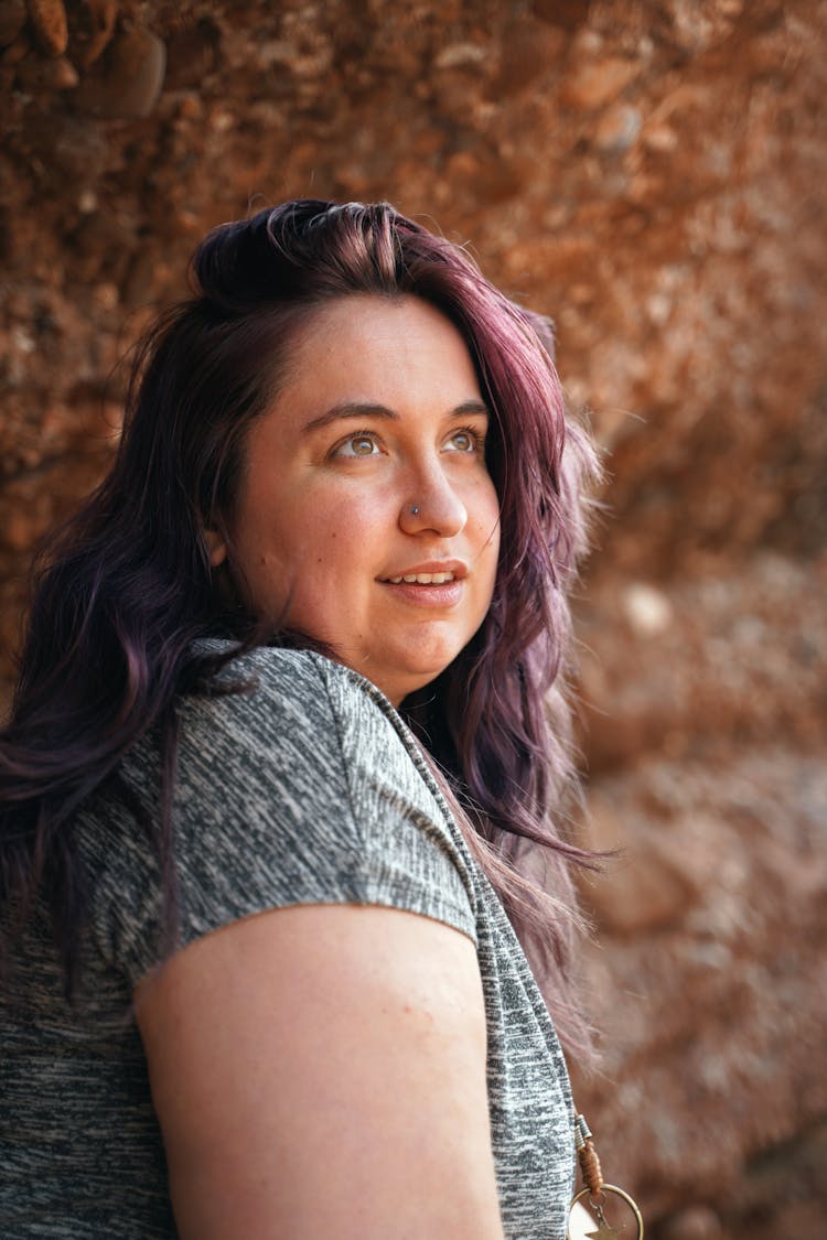 Woman Wearing A Gray Shirt Looking Up