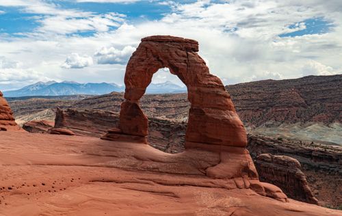 Free Stunning view of Delicate Arch against the Utah landscape in Arches National Park. Stock Photo