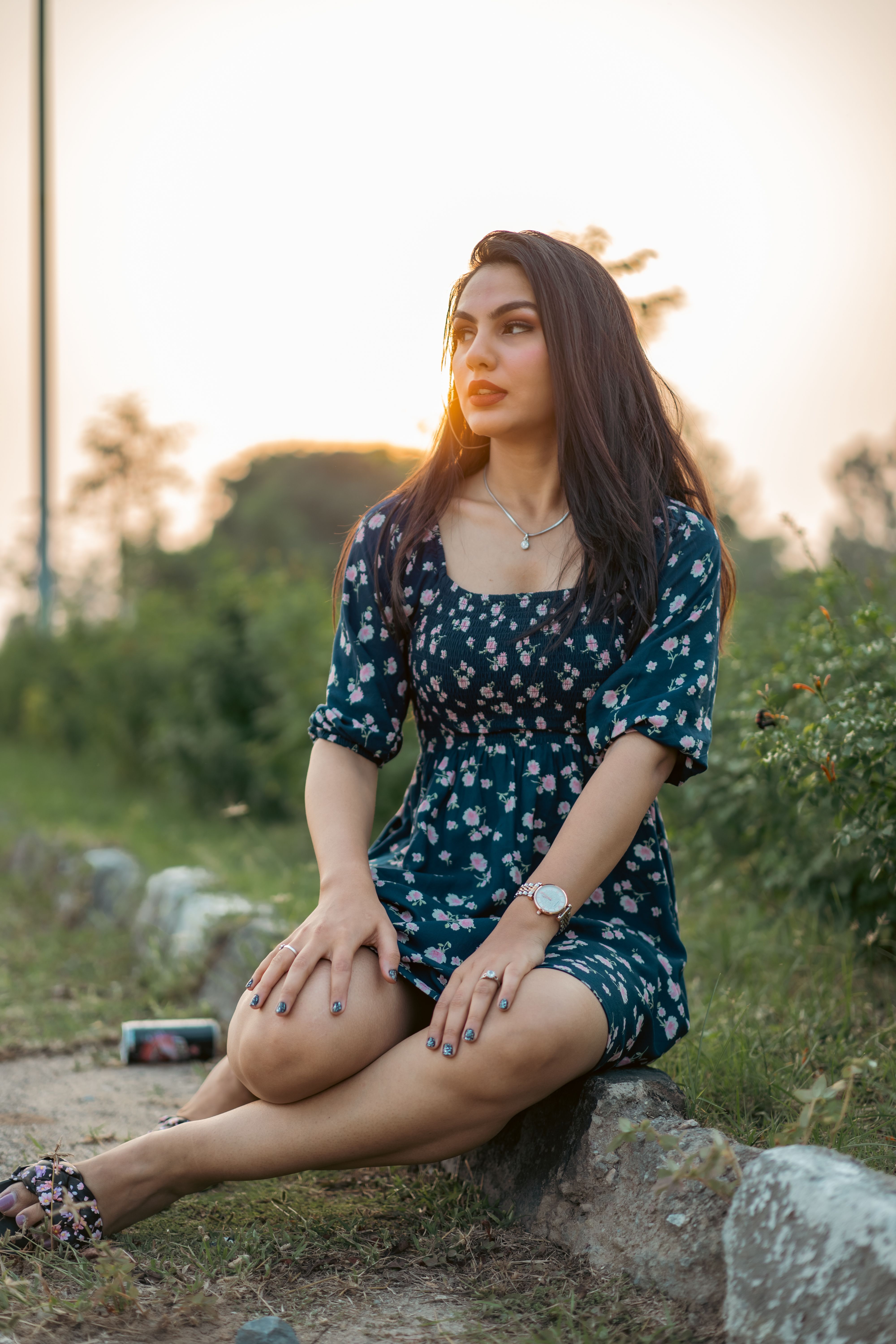 Woman Wearing Floral Dress Sitting on a Bench · Free Stock Photo