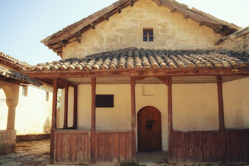 Old Stone House with a Wooden Porch 