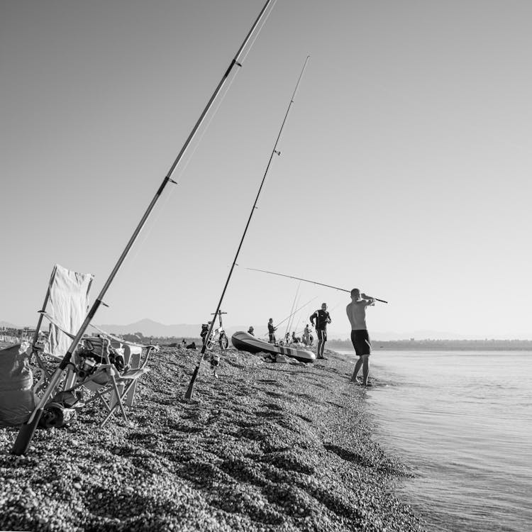 People Fishing On The Beach