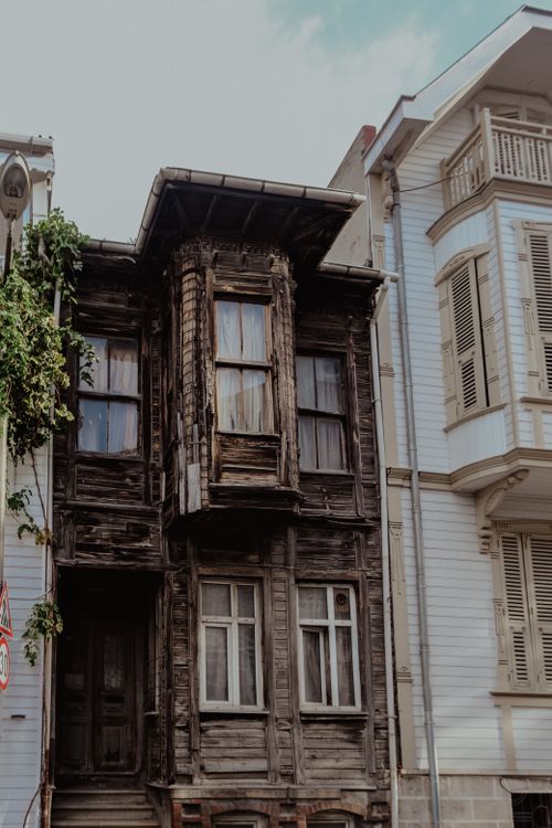 Free A picturesque view of traditional wooden houses in Istanbul, showcasing urban charm and architectural history. Stock Photo