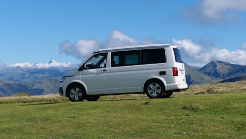 Free White Van Parked on Grass Field Stock Photo