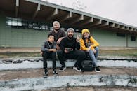 People Sitting on the Concrete Together