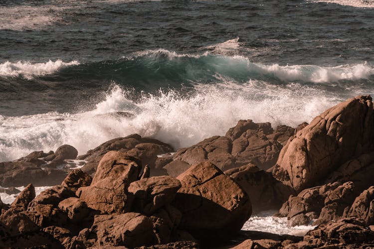 Photo Of Sea Waves Crashing On Rocks